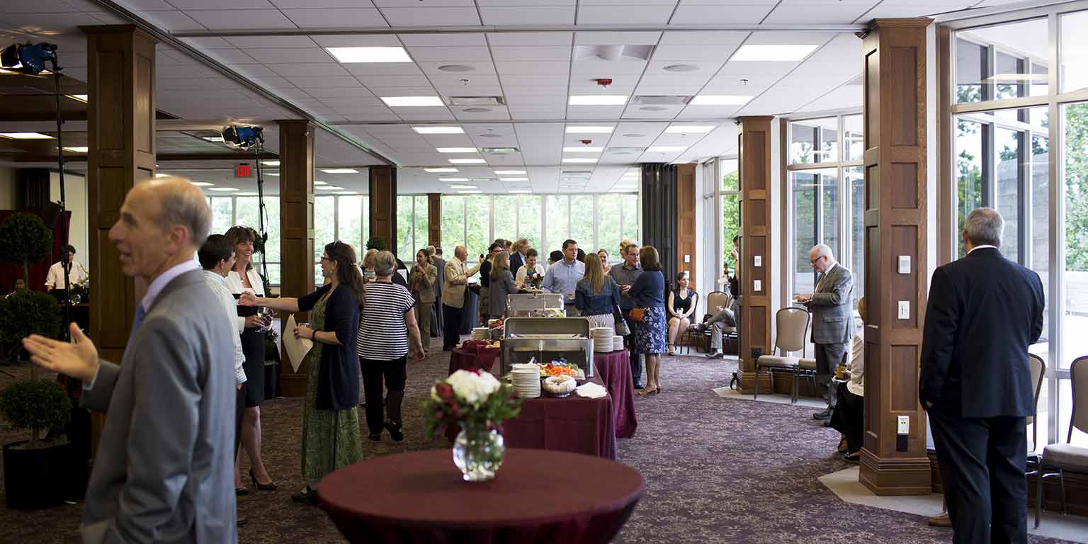 Guests enjoy a buffet lunch at an event in the Solarium in the Indiana Memorial Union.