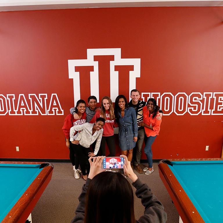 A group of students poses for a photo at Bowling and Billiards in the Indiana Memorial Union.