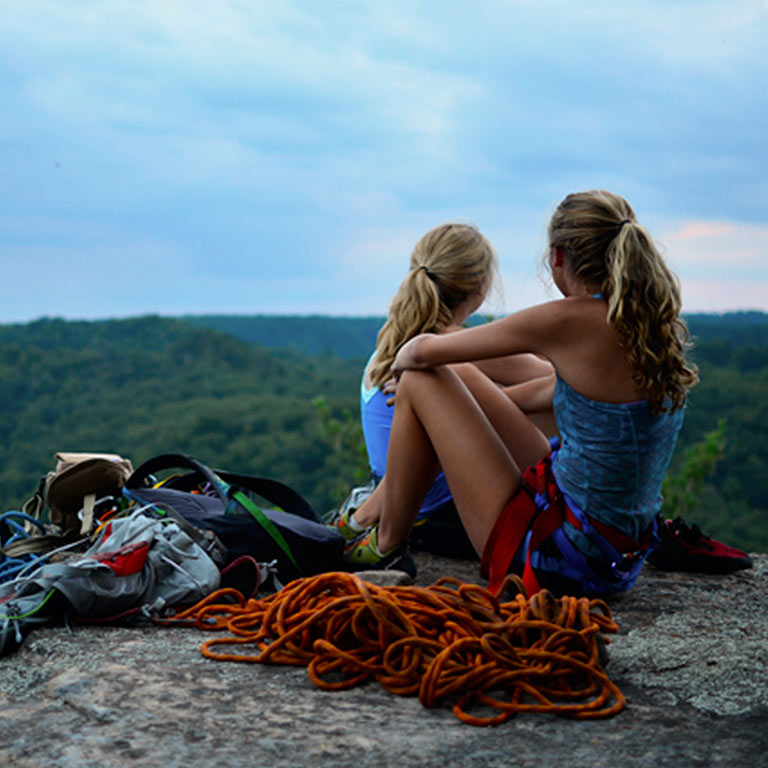 Climbers rest on the top of a mountain.